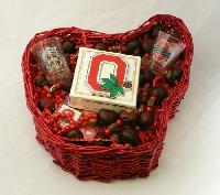 OSU Tailgate Kit - A red shaped Ohio basket filled with two Ohio State University shot glasses, two buckeye necklaces, box of 4 hand dipped buckeye candies, and four temporary tattoos
